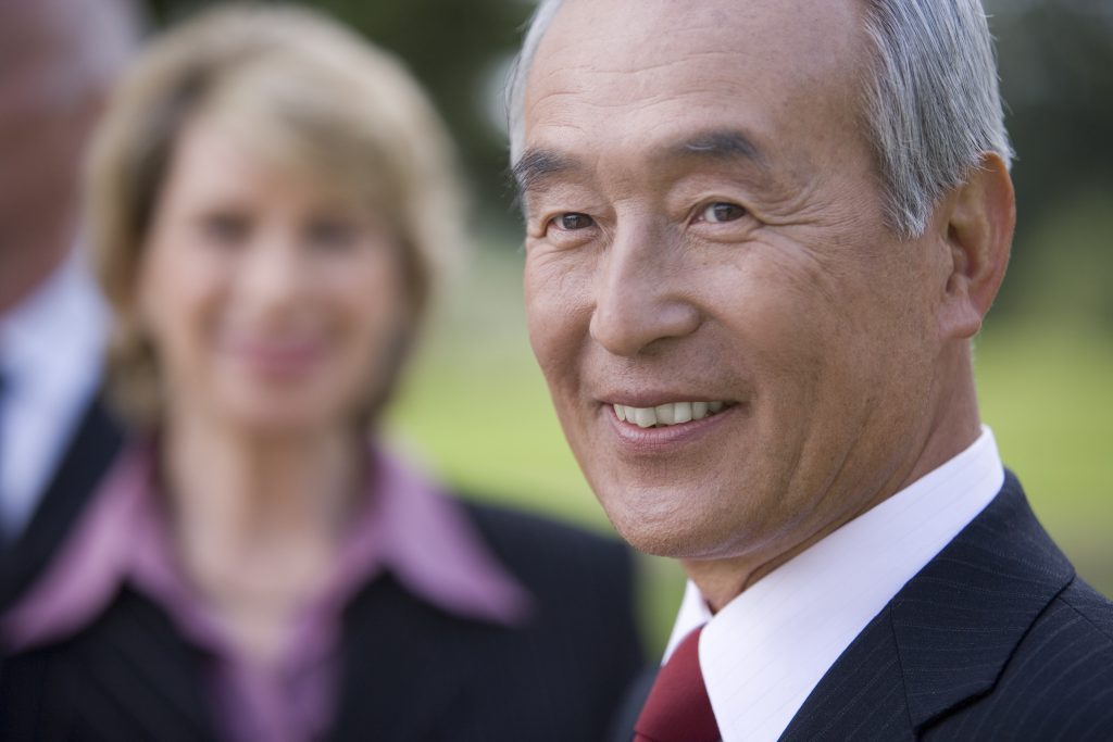 businessman-smiling-by-colleague-close-up-2025-10-14-04-28-55-utc