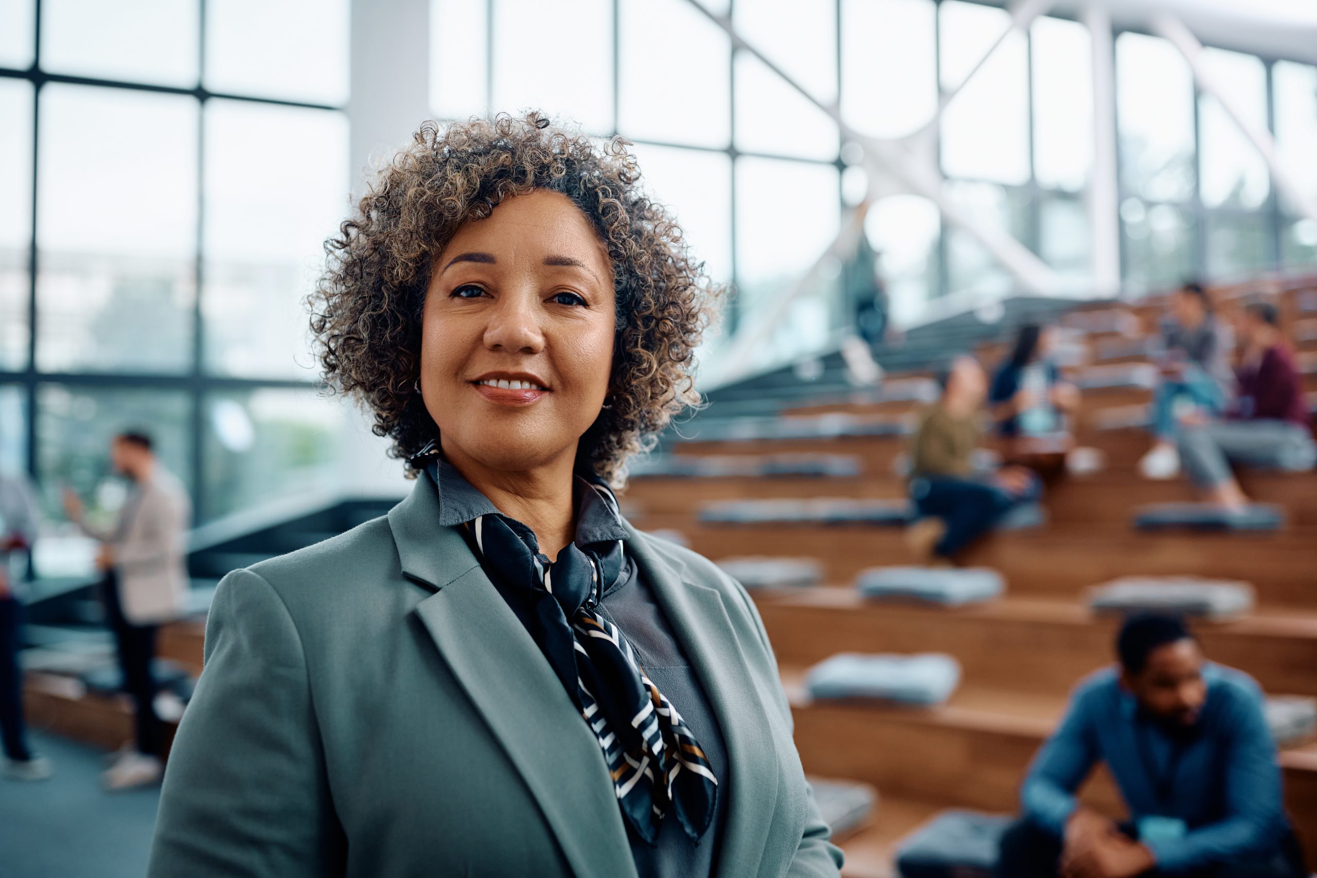 Female business leader during an education training at convention center looking at camera.